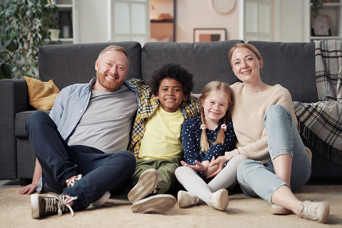 Foster parents with 2 foster children through Match Foster Care.