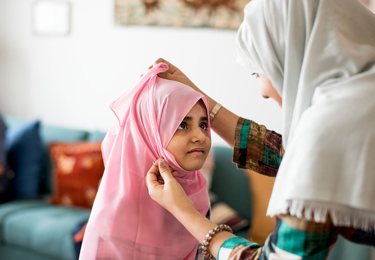 muslim-mom-teaching-daughter-how-to-wear-a-hijab-2025-02-10-10-46-17-utc.jpg